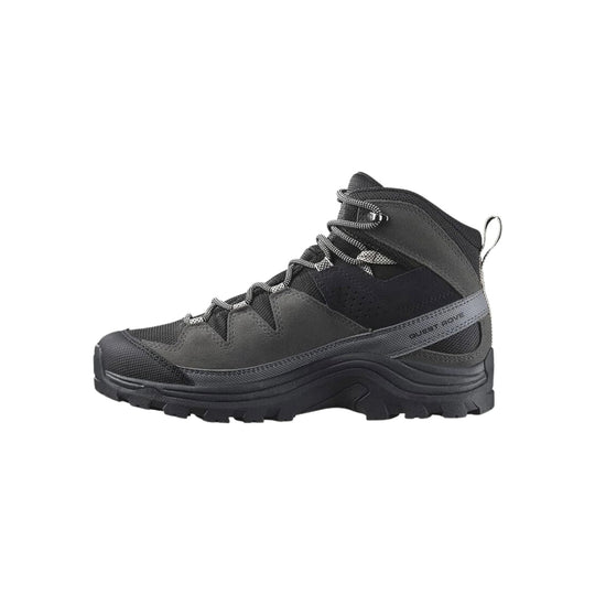 Black and gray hiking boot with bungee laces and side pull loop, shown in profile
