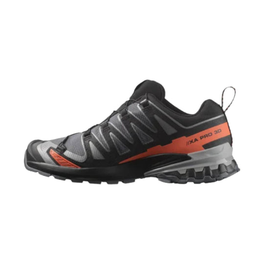 Black and gray trail running shoe with orange side panel and rugged lug sole