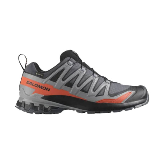 Gray and black trail running shoe with orange side panel and lugged sole
