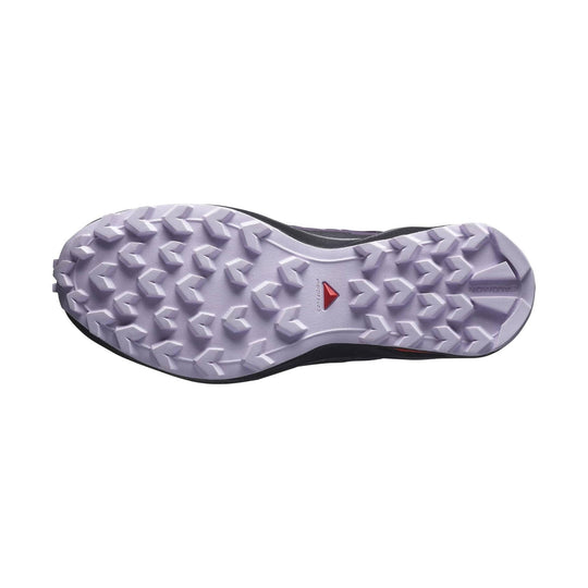 Trail shoe outsole with light lavender lug tread and black upper edge