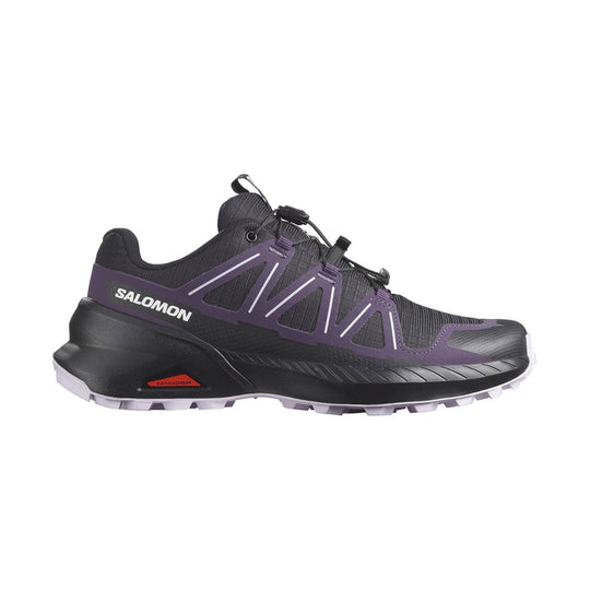 Black hiking shoe with purple side overlays, bungee laces, and Salomon branding