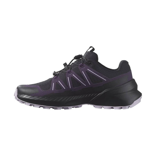 Black low-top hiking shoe with purple side overlays and a lugged outsole