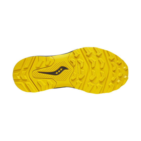 Yellow trail shoe outsole with deep lug tread and a black logo insert