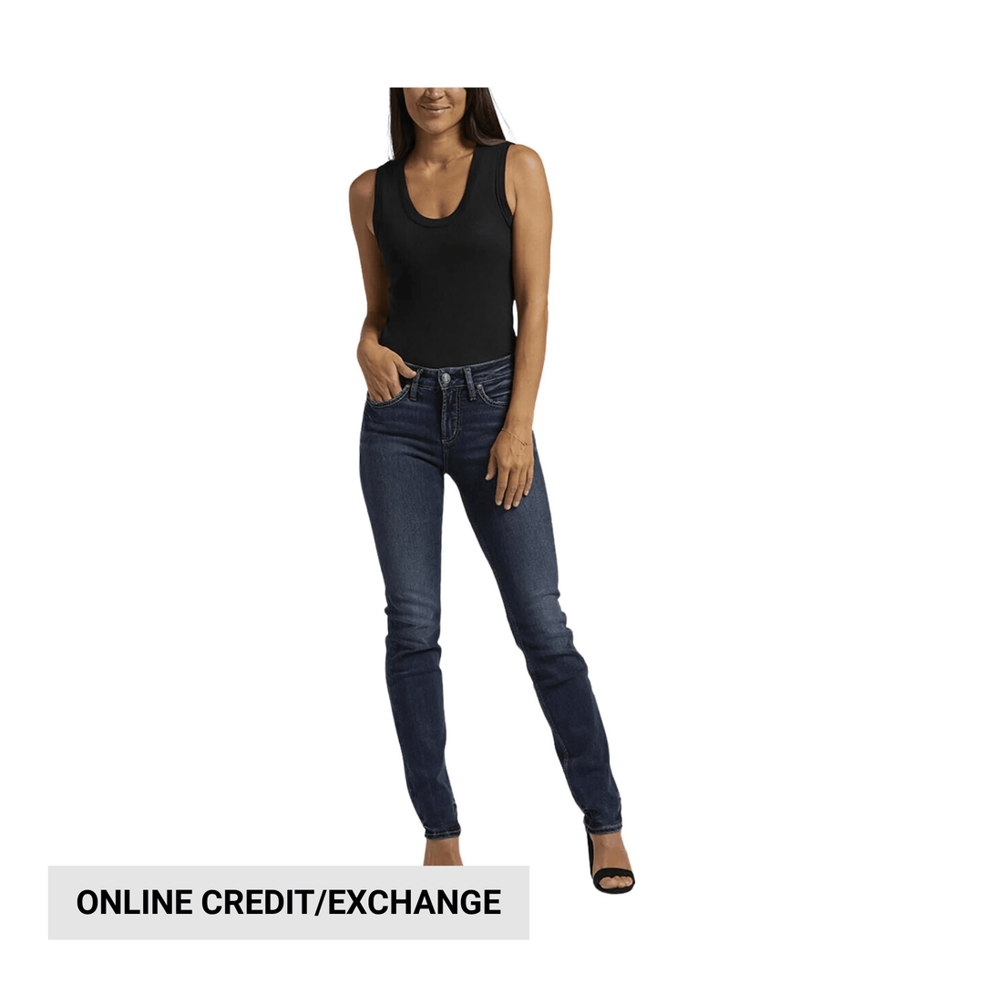 Dark wash skinny jeans on a model with a black tank top, with a banner reading online credit/exchange