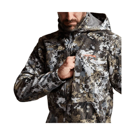 Camo hooded zip-up jacket with chest pocket and small orange logo