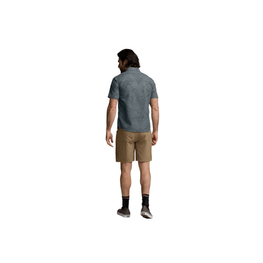 Gray short-sleeve button-up shirt, tan shorts, and black socks on a male model shown from the back