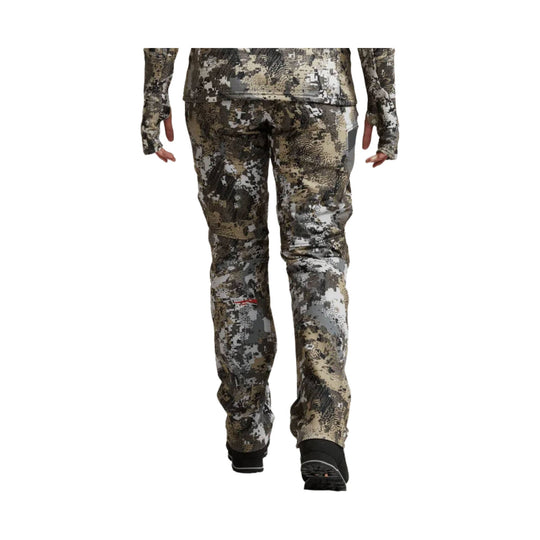 Camouflage women’s hunting pants shown on a model from the back