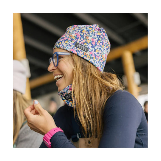 Multicolor floral knit beanie with a SKIDA label, shown with a matching neck gaiter