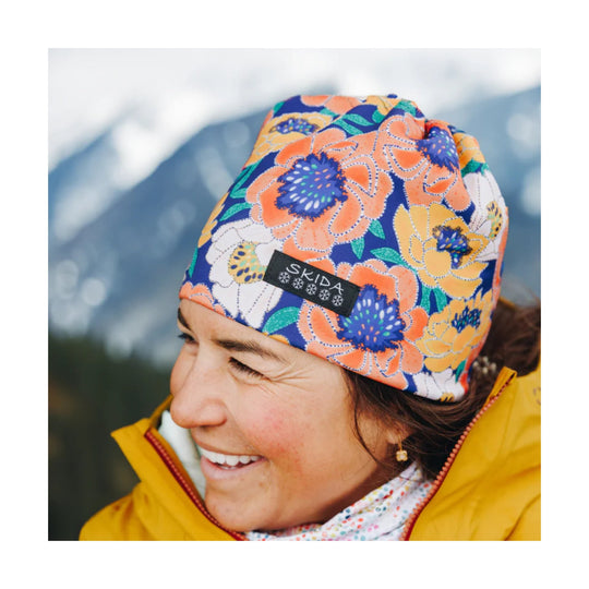 Colorful floral beanie with a black SKIDA label