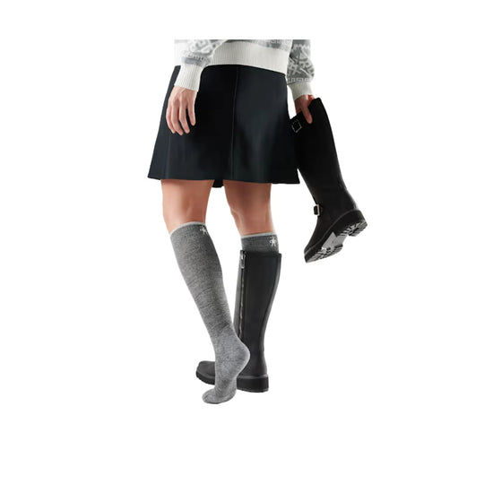 Gray knee-high sock on a model, shown with a black knee-high boot