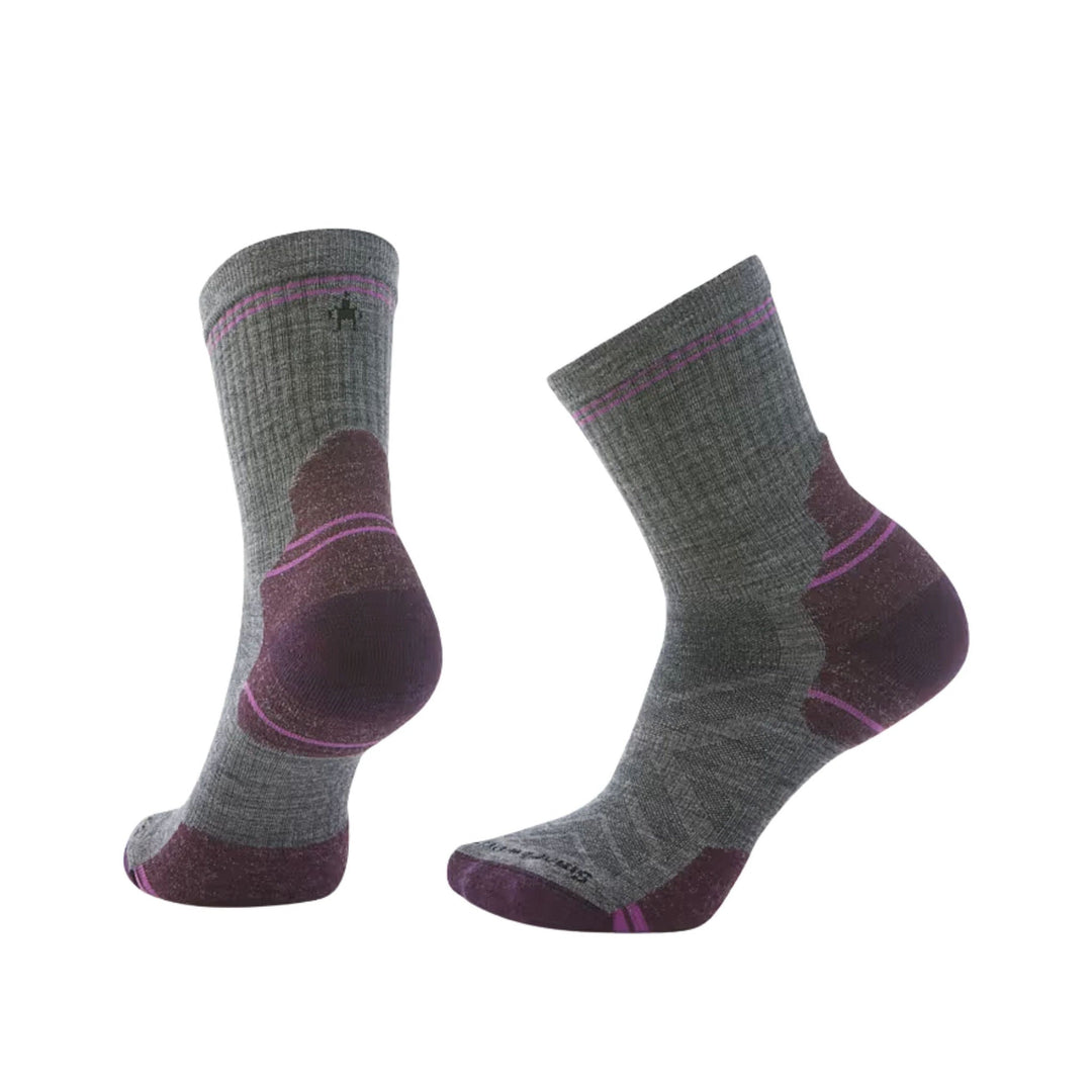Pair of gray and purple hiking crew socks with targeted cushioning and visible brand logo