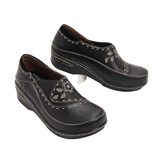 Black wedge clogs with floral embroidery and contrast stitching