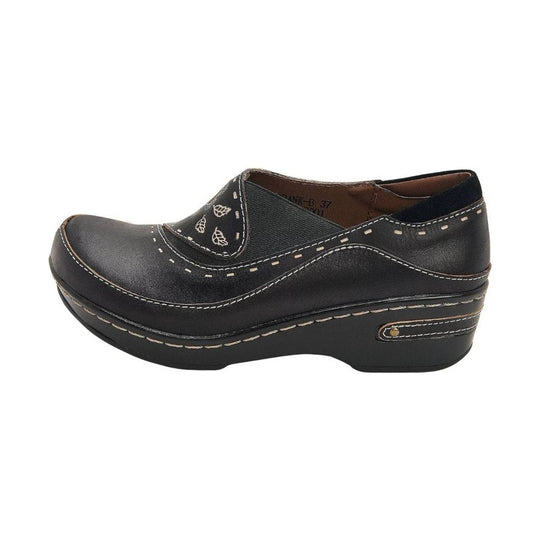 Black leather clog with wedge sole, white stitching, and leaf embroidery on the upper