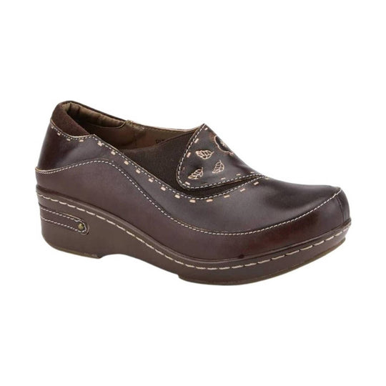 Brown leather wedge clog with white stitching, side elastic panel, and floral cutout detail