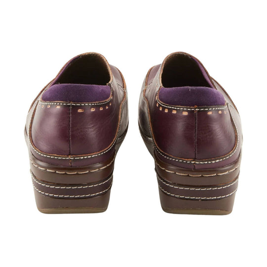 Pair of burgundy leather slip-on clogs with purple suede heel collars and stacked brown platform soles