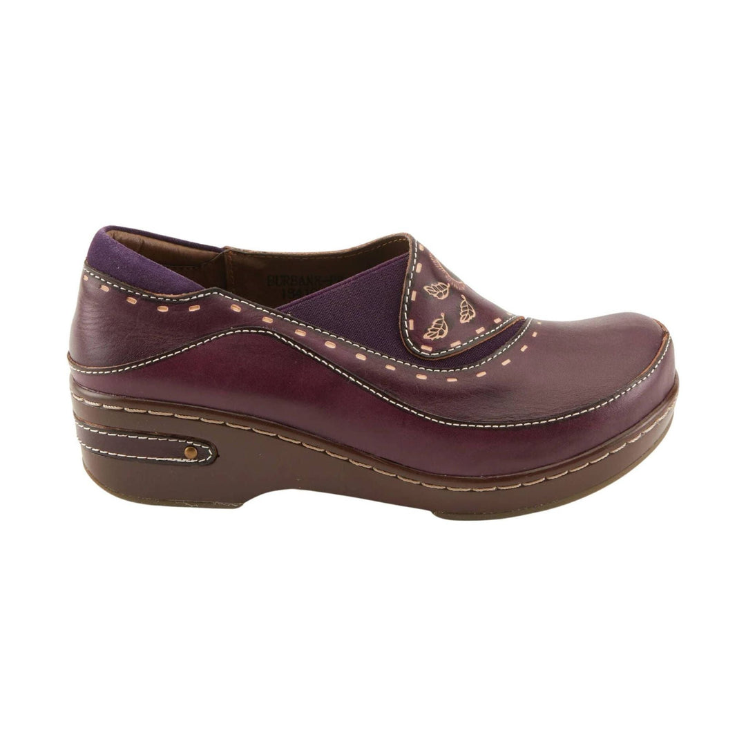 Purple leather clog-style shoe with floral cutout detailing and a brown wedge sole, side view