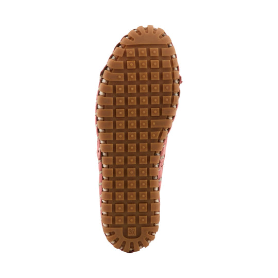 Bottom view of a pink shoe with a brown rubber sole and square tread pattern