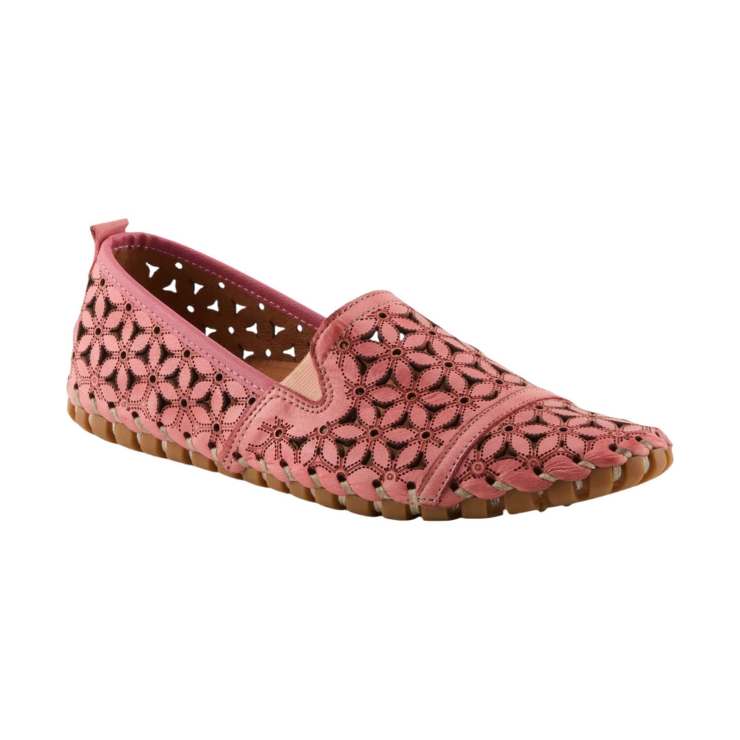 Pink leather slip-on shoe with floral cutout pattern and tan sole