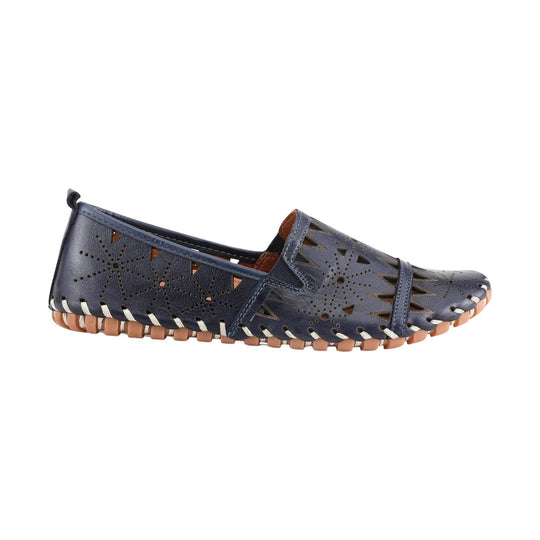 Navy perforated leather loafer with cutout floral pattern and tan woven sole