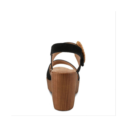 Black suede platform sandal with a wood-look wedge heel, rear view