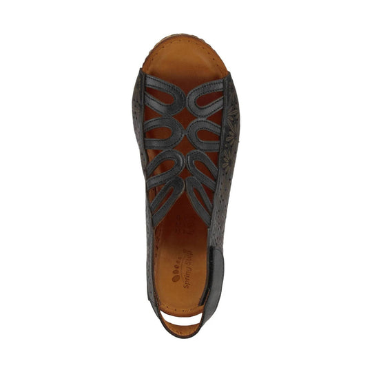 Black closed-toe slingback flat with woven cutout upper and tan insole