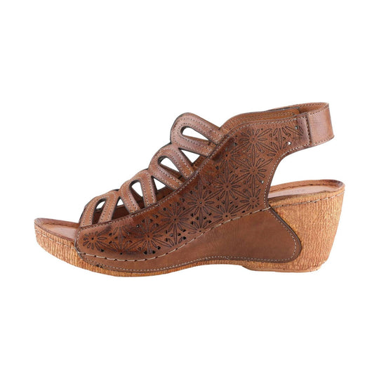 Brown leather wedge sandal with floral cutout sides and an open toe