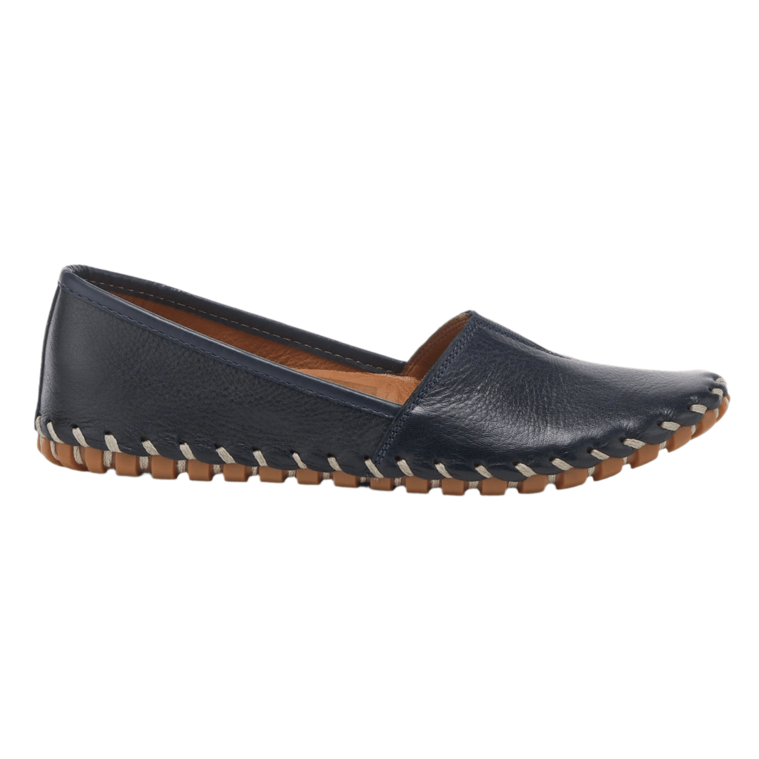 Navy leather slip-on shoe with tan sole and hand-stitched trim