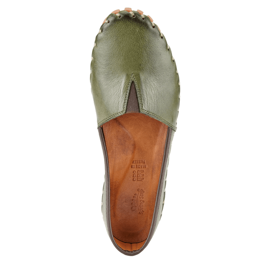 Olive green leather closed-toe flat with cutout vamp and brown leather insole, top view