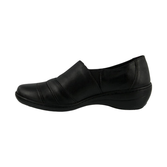 Black slip-on shoe with a rounded toe, wide top strap, and low wedge sole