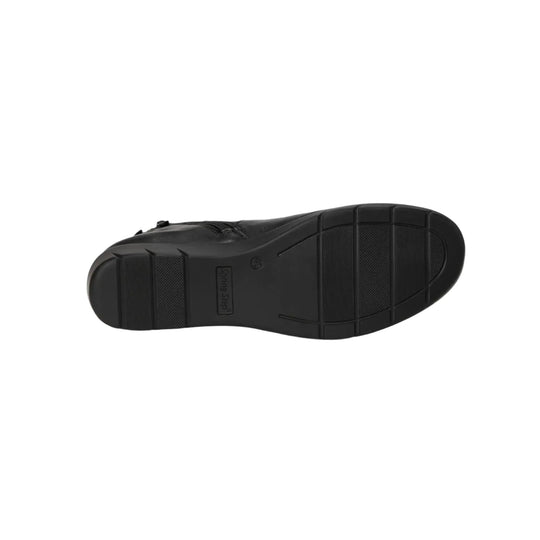 Black wedge boot outsole with tread pattern and logo stamp