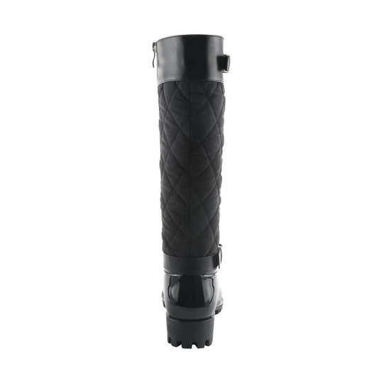 Black quilted knee-high rain boot with glossy heel and lug sole, rear view