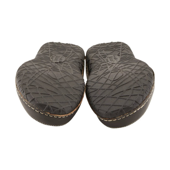 Pair of dark brown slip-on shoe soles with textured tread