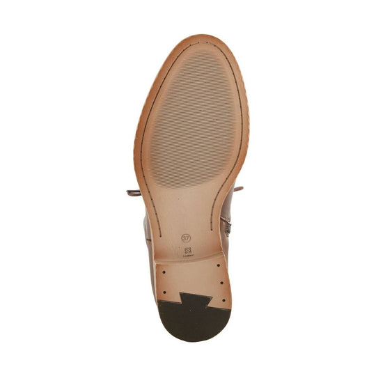Tan boot sole with ribbed tread, stitched outsole edge, and black heel insert