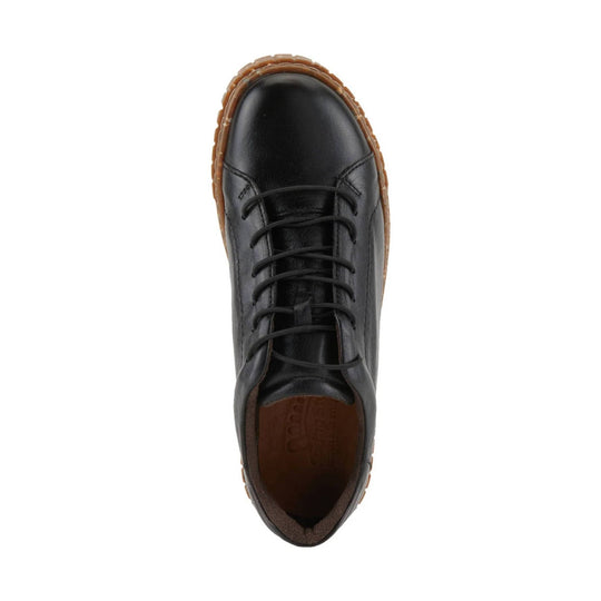 Black lace-up shoe with rounded toe and brown welt sole, top view