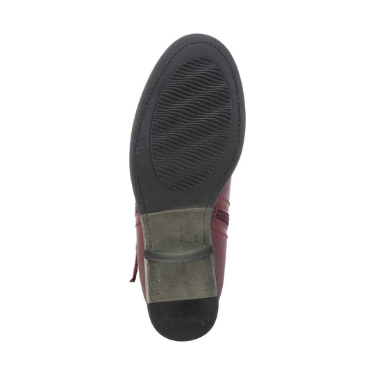 Black boot sole with wavy tread and a size 37 marking, viewed from below