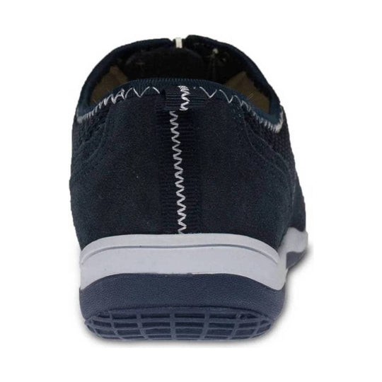 Navy slip-on sneaker seen from the back with a white midsole and black outsole