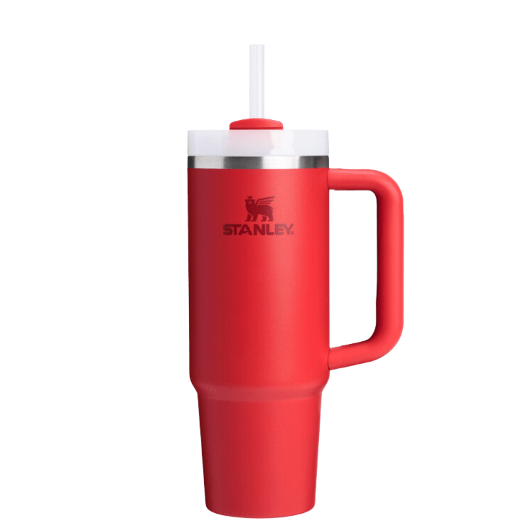 Red handled insulated tumbler with straw and lid, showing a Stanley logo on the front