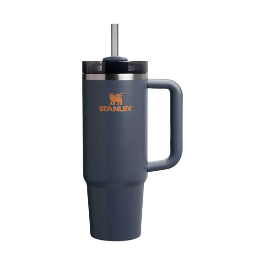 Dark blue handled tumbler with a straw and Stanley logo