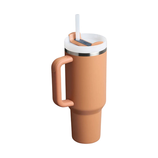 Peach insulated tumbler with handle, white lid, and clear straw