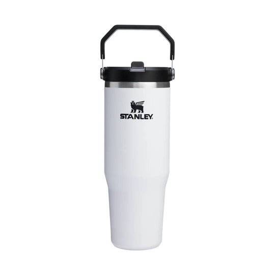 White insulated tumbler with black lid and handle, showing the STANLEY logo