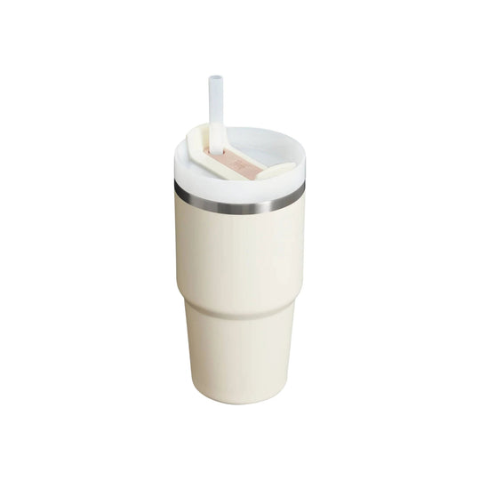 Cream insulated tumbler with a clear lid and straw