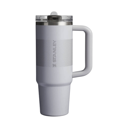 Gray handled tumbler with clear flip-straw lid and vertical Stanley logo