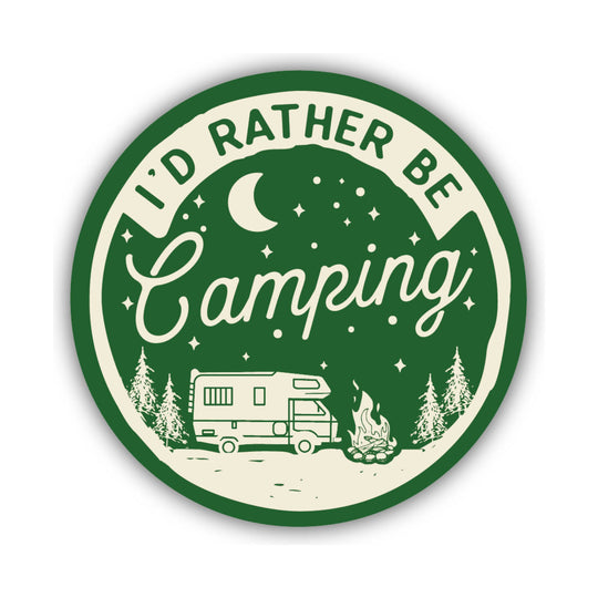 Round green-and-cream camping sticker with an RV, campfire, pine trees, moon, and stars