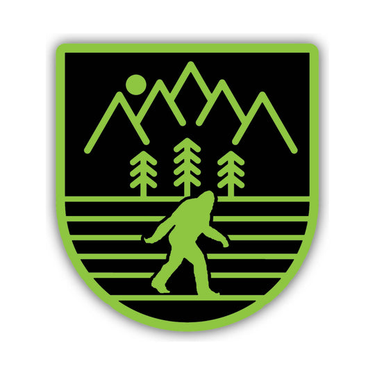 Black and neon green shield-style sticker with mountains, trees, and a Bigfoot silhouette