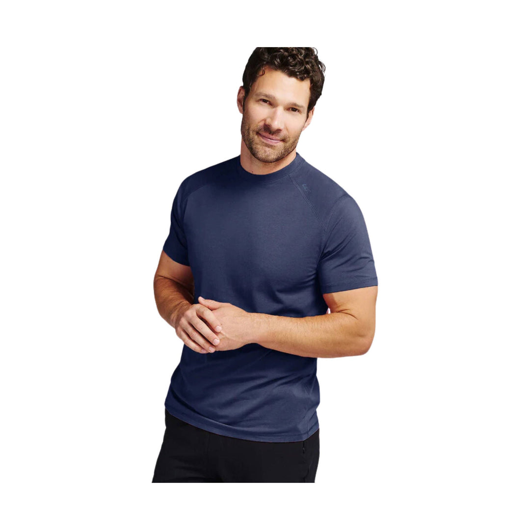 Navy short-sleeve athletic T-shirt on a man against a white background