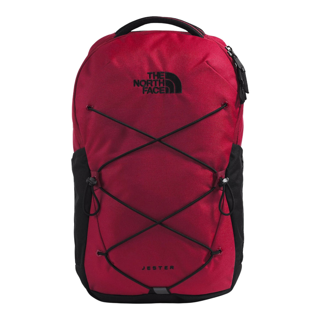 Red backpack with black trim, front bungee cords, and top carry handle