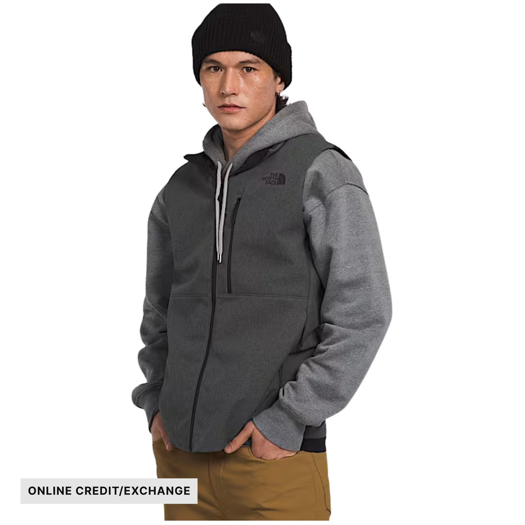 Gray zip-front fleece vest worn over a gray hoodie, with visible online credit/exchange text