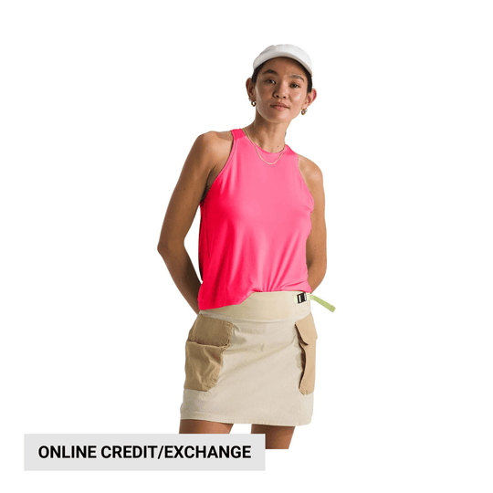 Pink sleeveless tank top with cream mini skirt and large cargo pockets on a model