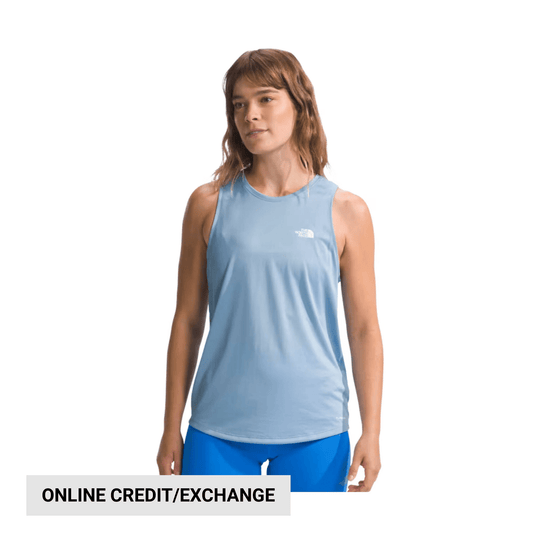 Light blue sleeveless athletic tank top worn with blue leggings