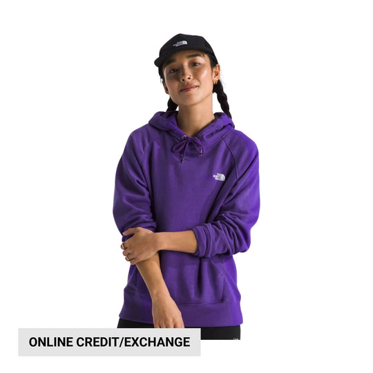 Purple pullover hoodie with drawstring hood and chest logo, shown with a black cap
